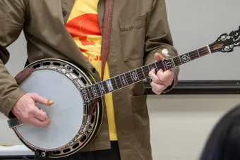 A person playing a banjo