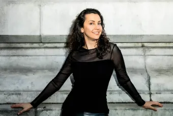 Anna Petrova standing in front of a building