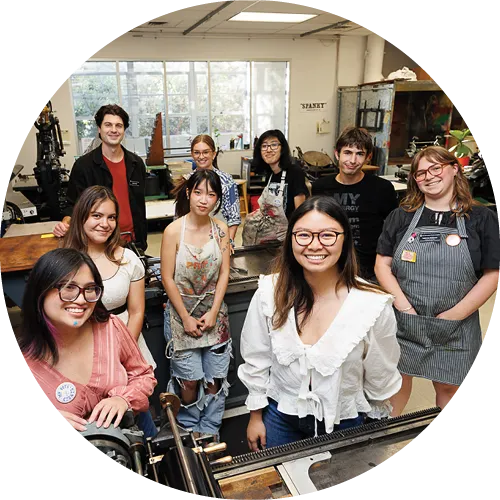 Students smiling at the design lab