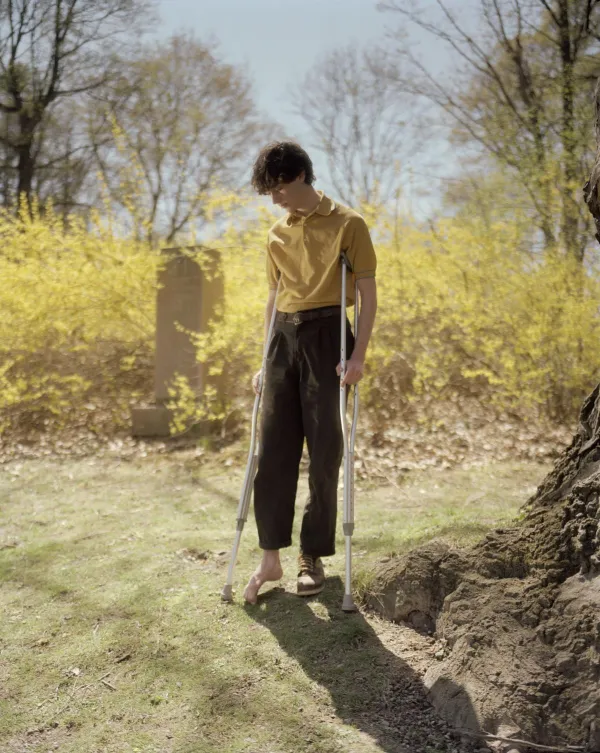   <img loading="lazy" src="/sites/aah/files/2023-10/halpern-17.jpg" width="2392" height="3000" alt="image of man on crutches at a cemetary" />

