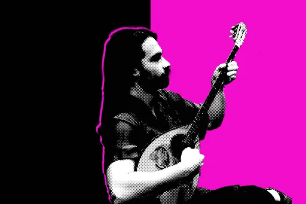 A student performs on an oud.