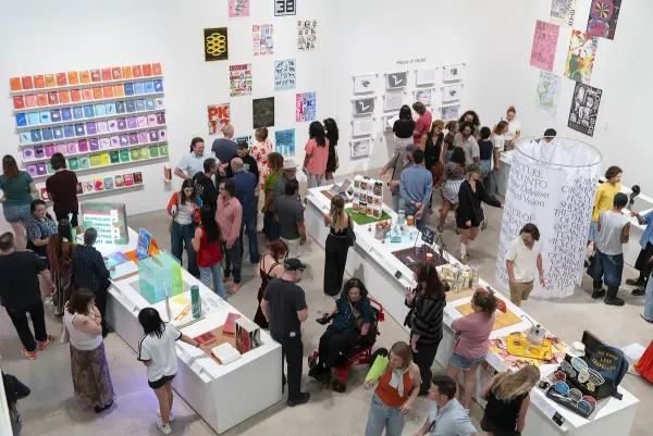 people in gallery during art opening