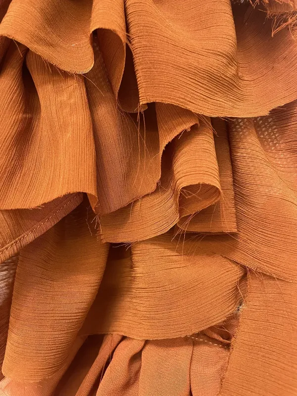 pieces of woven clothe layered over one another