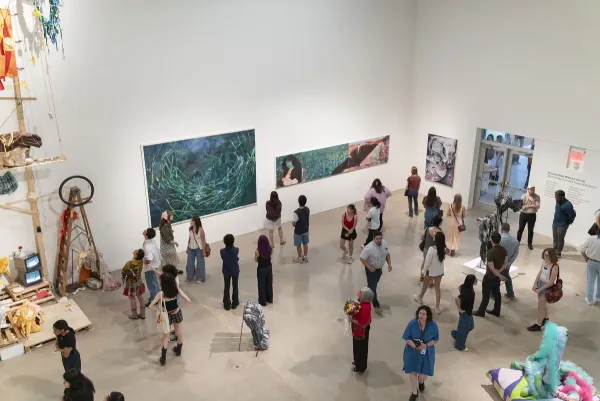 people in gallery during art opening