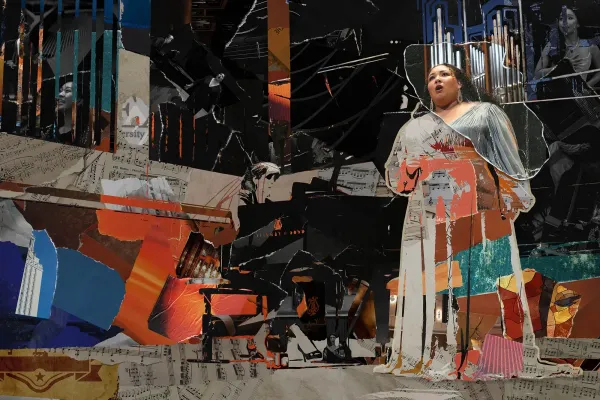 A collage of torn paper that creates an image of a singer and pianist on a concert hall stage