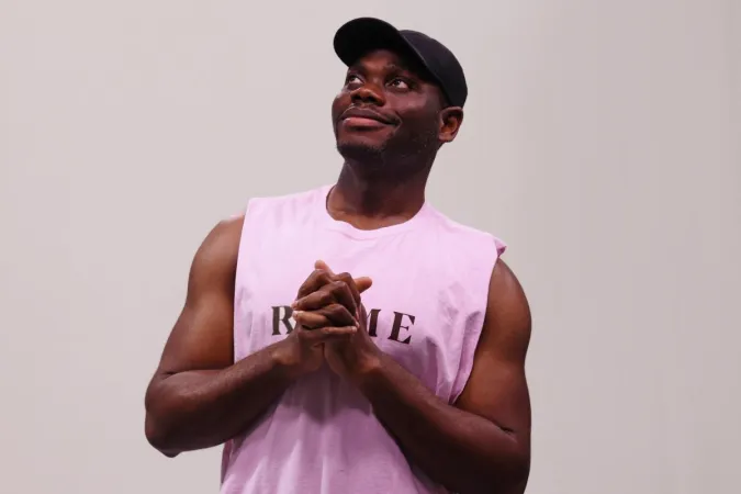 Sinclair Photo in pink tank looking up
