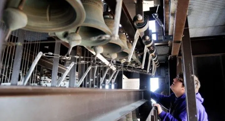 Austin Ferguson looking at a carillon