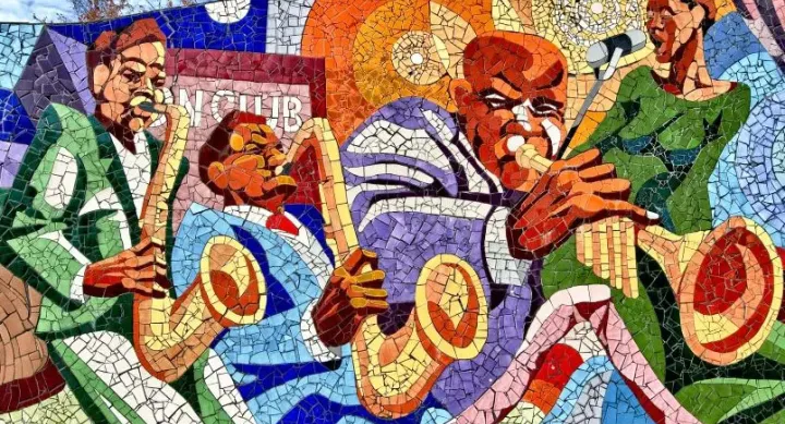A colorful mosaic mural depicting musicians playing saxophones and trumpets