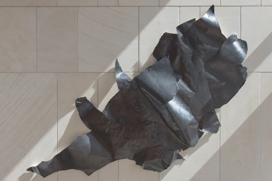 A metal sculpture on the wall
